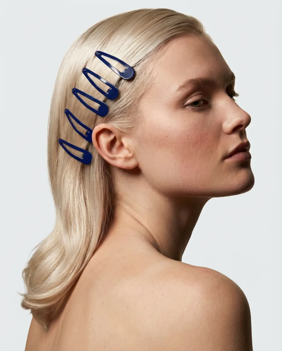 Model styled with blue hair clips
